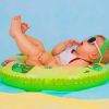 Baby Lying On Flatable Ring painting by numbers