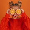 Girl In Orange Sweater Holding Lemon painting by numbers